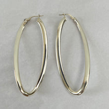 Load image into Gallery viewer, Vintage Italy Sterling Silver Oval Hoop Earrings. Stamped 925, Italy. Pierced, with self contained hook and closure. The hoops are designed to create visual interest. As they move they almost appear to twirl and dance! Vintage Italy hoop earrings. 
