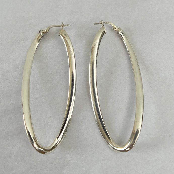 Vintage Italy Sterling Silver Oval Hoop Earrings. Stamped 925, Italy. Pierced, with self contained hook and closure. The hoops are designed to create visual interest. As they move they almost appear to twirl and dance! Vintage Italy hoop earrings. 