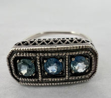 Load image into Gallery viewer, Vintage sterling silver filigree ring with three blue stones - size 8.This vintage sterling silver ring features three blue round cut stones set in a delicate filigree setting. Round cut, prong set stones, with an open back.  Excellent vintage condition. Perfect gift for a mother of 3 for Mother&#39;s day! 
