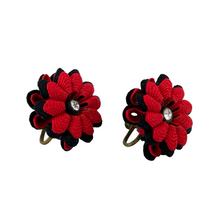 Load image into Gallery viewer, Mid Century Red and Black Ribbon Flower Screw Back Earrings. 1&quot; x 1&quot;. The perfect Dia de los Muertos, Frida style earrings! Featuring a ribbon floral design surrounding a rhinestone in the middle of the flower. Brass screw back closure.  Excellent vintage condition. The screw back works properly.   Processed within 1 business day (not included in shipping carrier’s estimated arrival time). Tracking uploaded immediately upon shipment.
