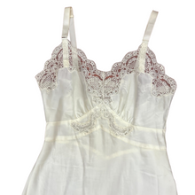 Load image into Gallery viewer,  Vintage Full Dress Slip Size 32. Features lace trim, and adjustable straps. Made in the USA. 100% nylon.
