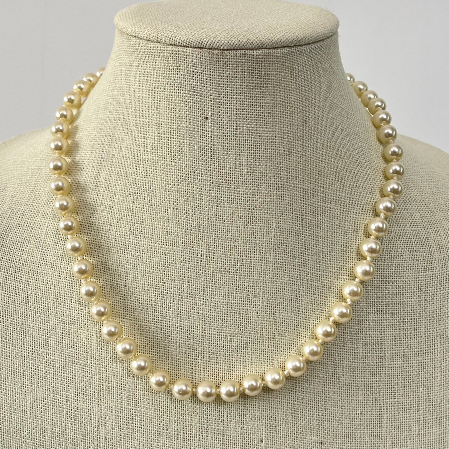 Retro Knotted Faux Pearl Necklace with gold tone filigree push lock closure. 