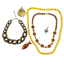 Load image into Gallery viewer, Chunky Boho Jewelry. This curated lot of jewelry includes 2 vintage beaded necklaces, 1 contemporary faux tortoiseshell necklace, one amber colored fish pendant, one teardrop shaped pendant and one shell inlay pendant with crystal or glass stones.
