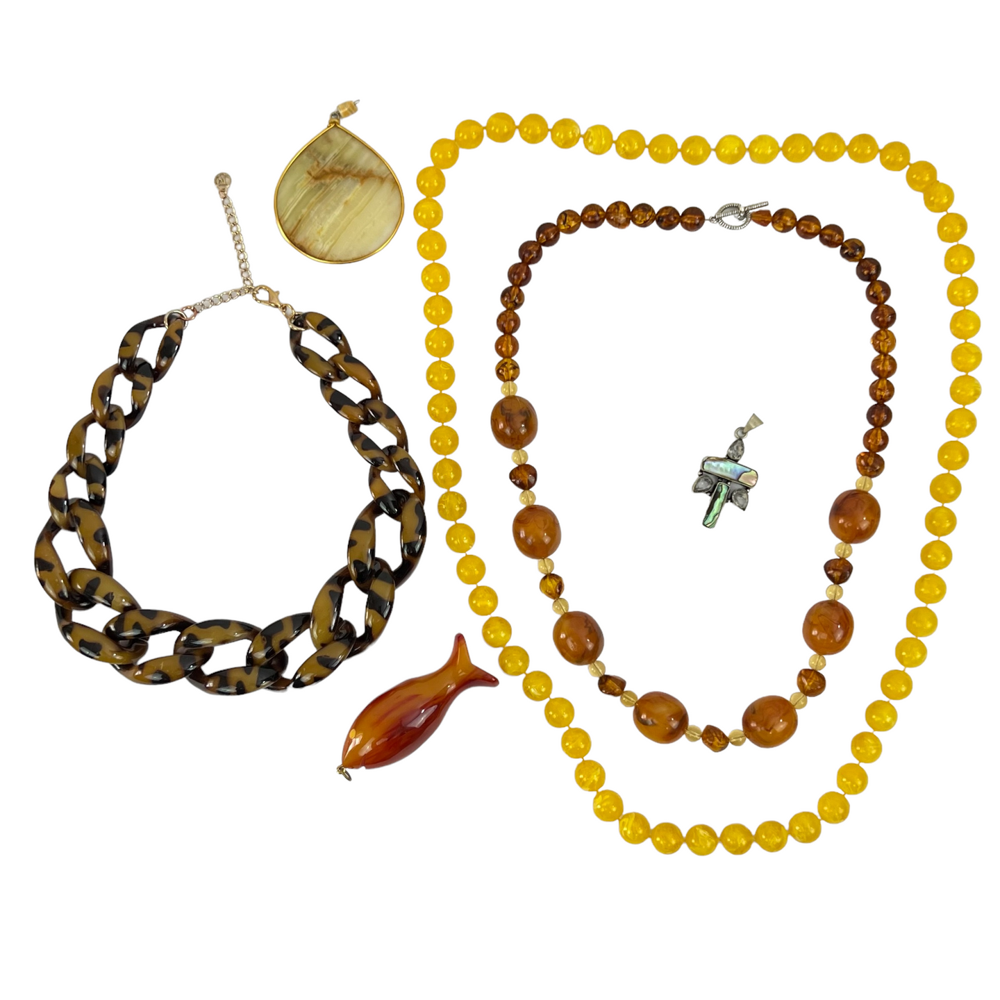 Chunky Boho Jewelry. This curated lot of jewelry includes 2 vintage beaded necklaces, 1 contemporary faux tortoiseshell necklace, one amber colored fish pendant, one teardrop shaped pendant and one shell inlay pendant with crystal or glass stones.